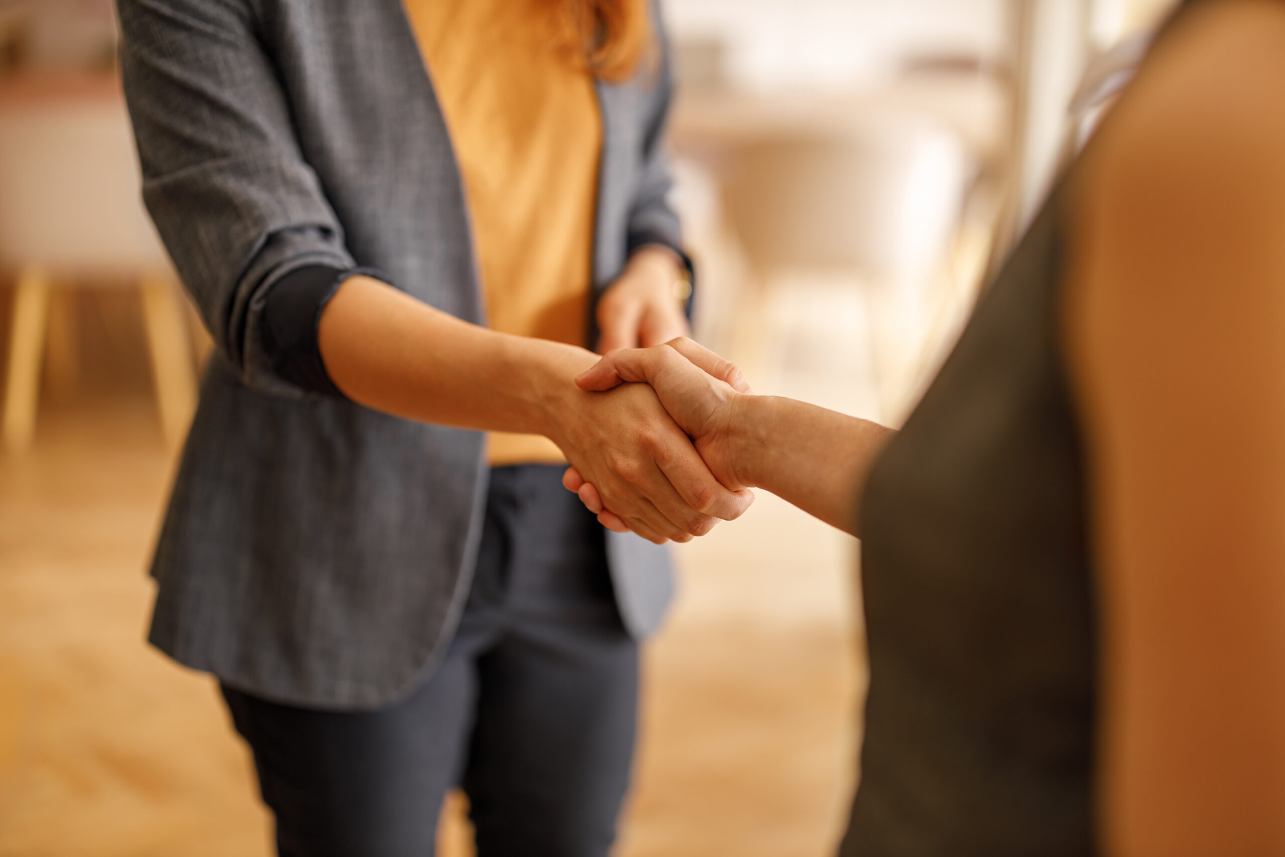Greeting with a firm handshake