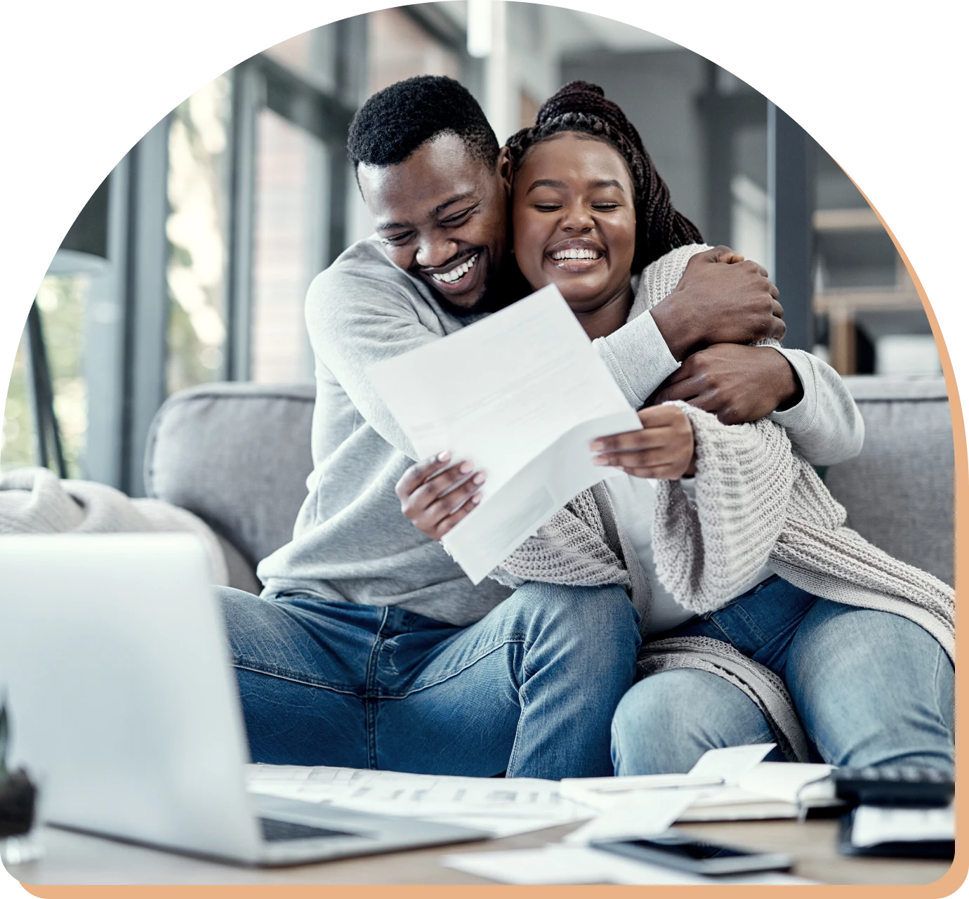 Couple celebrating good news at home